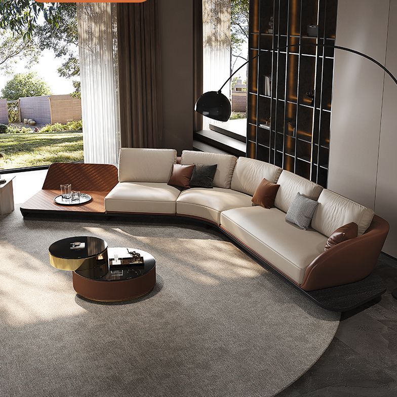 โซฟาเฟอร์รารีหนังแท้ห้องโถงแนวนอนไม่สะท้อนบนผนังพาร์ทเมนท์ขนาดใหญ่รูปทรงพิเศษแสงหรูหราส่วนโค้งสะท้อนความรู้สึกระดับไฮเอนด์ขนาดใหญ่