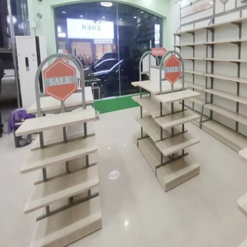 ที่กาหนดเองทารกเสื้อผ้าตู้แสดงผลิตภัณฑ์เด็กยืนแสดงแม่เด็กร้านเสื้อผ้าเด็กนากาจิมะชั้นวางตาราง